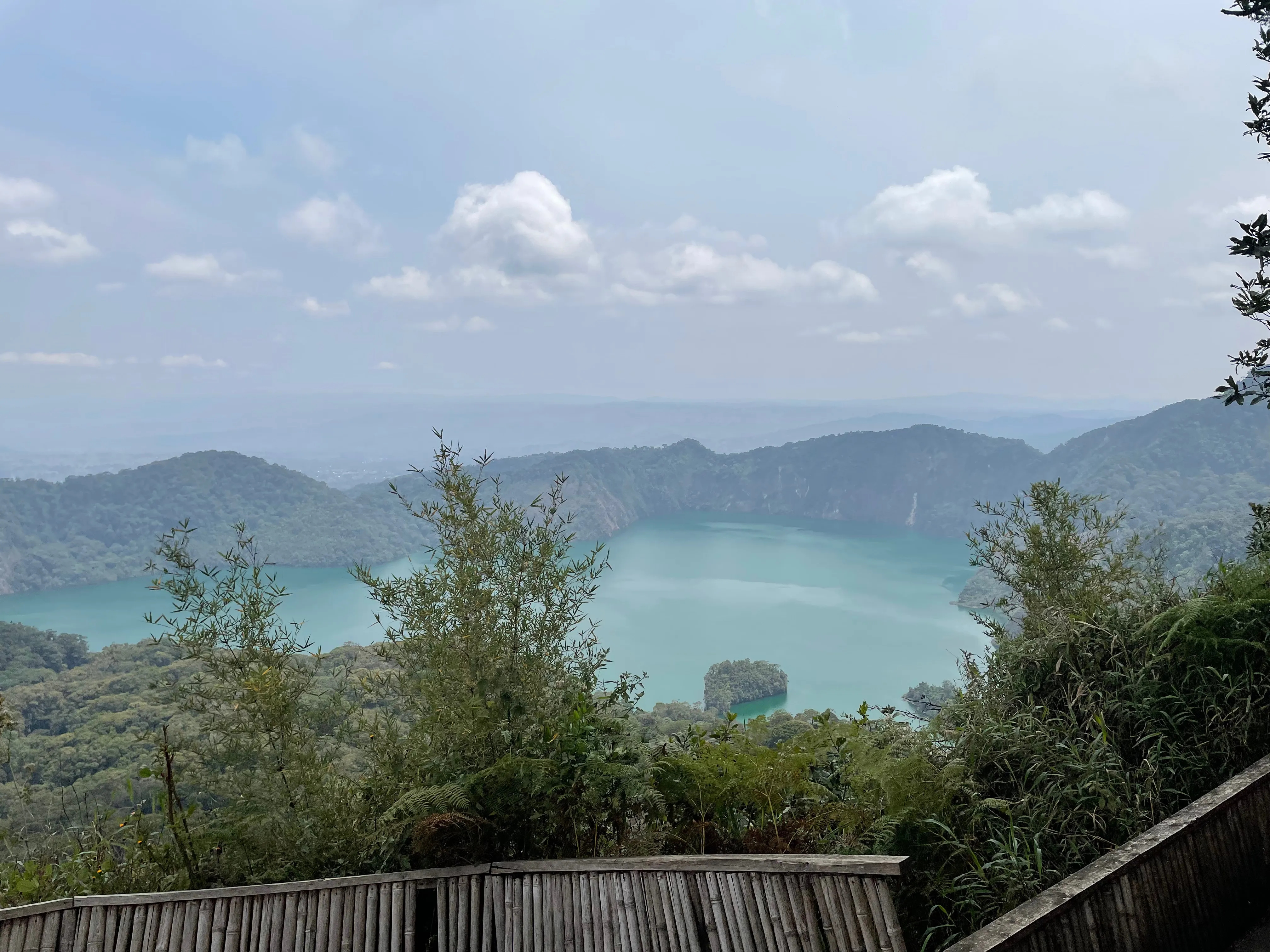 Emerald Lake Ngozi within its forested volcanic crater near Mbeya