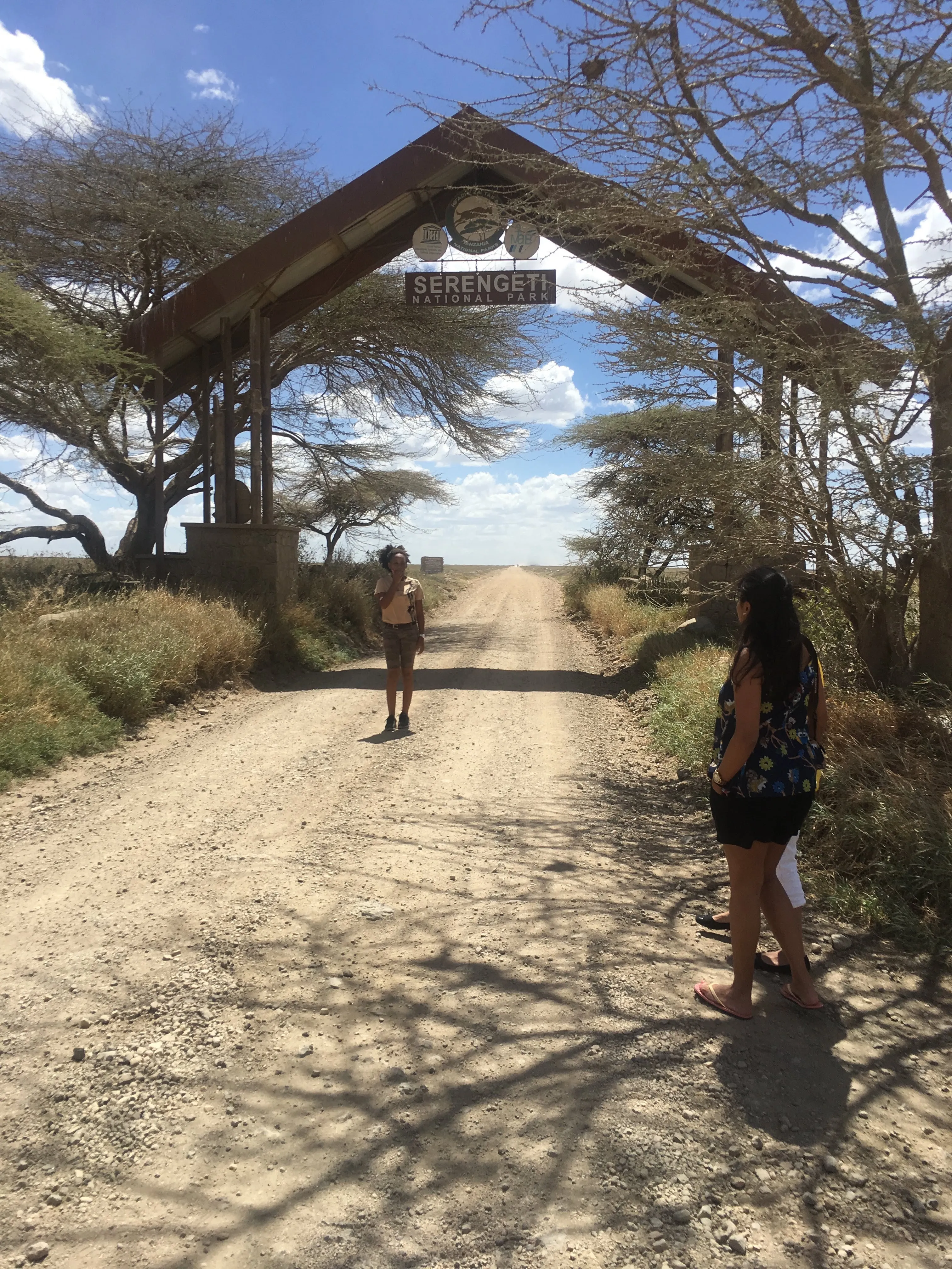 Travellers pausing on the road toward Serengeti National Park